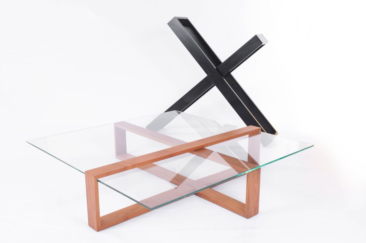 Glass coffee table with a timber base and black crossed legs