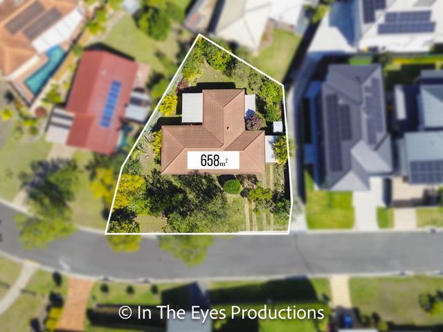 Aerial drone view of a suburban house with the property boundary outlined