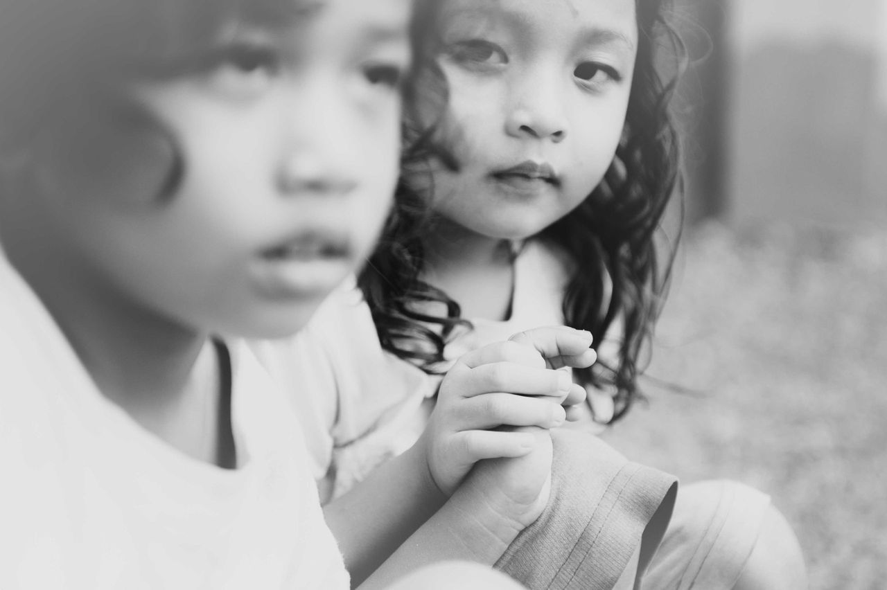 Black-and-white portrait of two young children